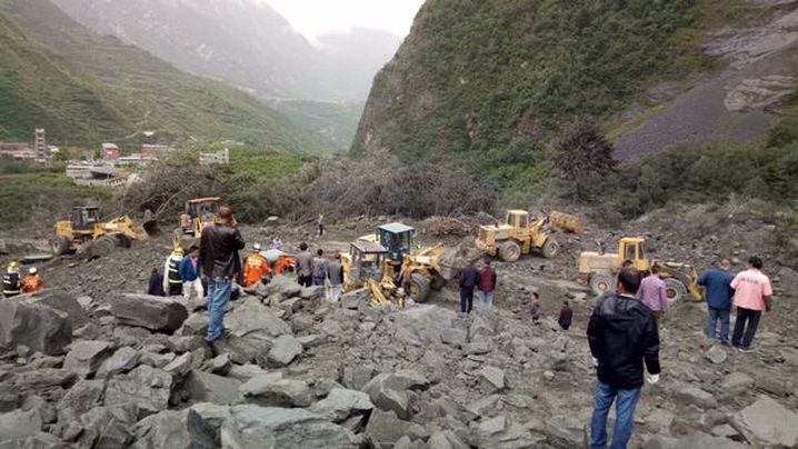 Rescuers dig for bodies after landslide wipes out village in southwestern China
