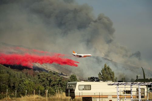 More than 230 firefighters, including helicopters, bulldozers and firefighting equipment, are battling the inferno. Picture: AP.