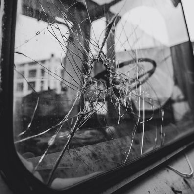 Stock image of a smashed car window.