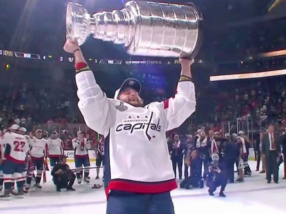 Alex Ovechkin receives mini trophies for winning Stanley Cup and being  named playoff MVP