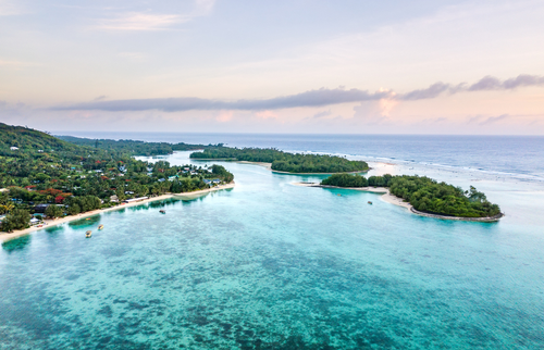 An aerial view of Muri Lagoon at sunrise in Rarotonga in the Cook Islands