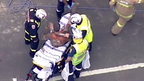 The rescued man was loaded onto the stretcher. (9NEWS)