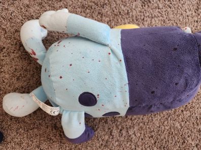 Bluey toy covered in red stains. 