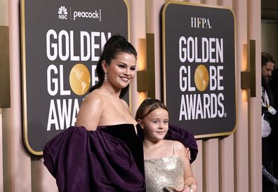 Selena Gomez, left, and Gracie Elliott Teefey arrive at the 80th annual Golden Globe Awards
