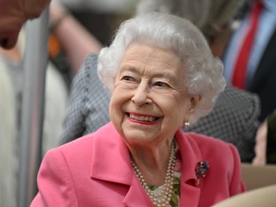 Queen Elizabeth II is given a tour during a visit to The Chelsea Flower Show 2022 at the Royal Hospital Chelsea on May 23, 2022 in London, England. 