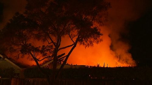 One witness said the house fire looked more like a fierce bushfire. (9NEWS)