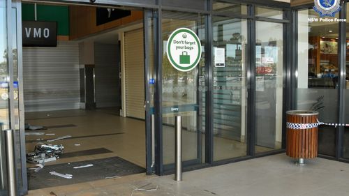 The front doors of the shopping complex in Moama that the thieves drove the bobcat through.