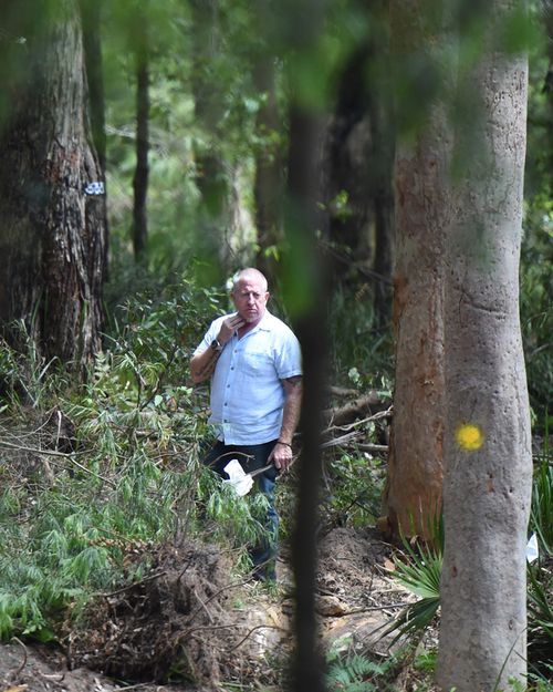 Father's mission: Mark Leveson wanders bushland as NSW Police search the site where it is believed Matthew Leveson is buried in the Royal National Park near Waterfall south of Sydney. Source: AAP