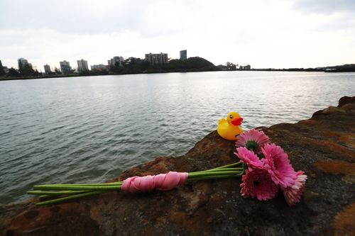 The flowers mark the spot where a nine-month-old girl was thrown into the water.