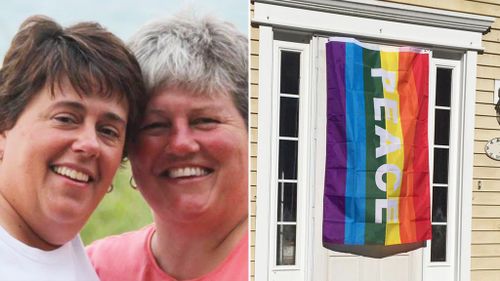 Neighbours display rainbow flags in solidarity with gay couple after homophobic attack
