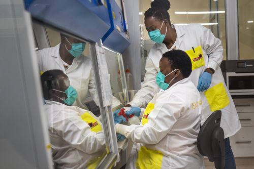 Melva Mlambo, right, and Puseletso Lesofi, both medical scientists prepare to sequence COVID-19 omicron samples at the Ndlovu Research Center in Elandsdoorn, South Africa Wednesday Dec. 8, 2021.  