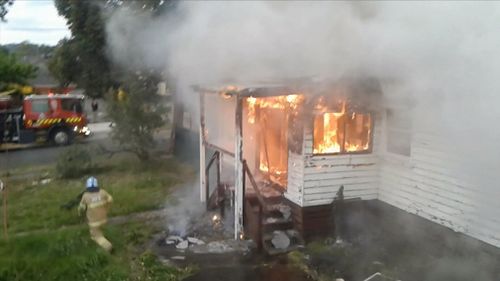 A 25-year-old man has been arrested after an abandoned home in Melbourne's east was badly damaged by a “suspicious” blaze.