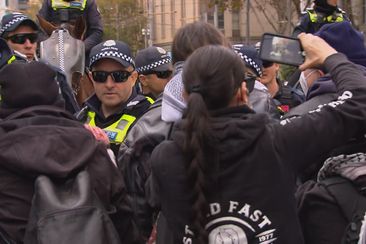 Protesters clash outside Victorian parliament.