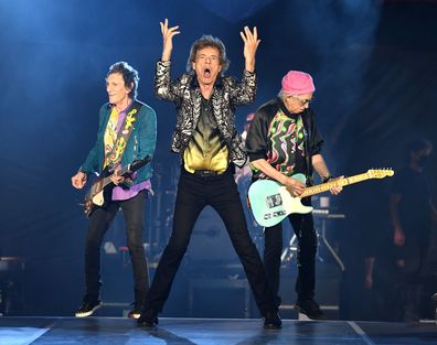  Ronnie Wood, Mick Jagger and Keith Richards of The Rolling Stones perform onstage at Nissan Stadium on October 09, 2021 in Nashville, Tennessee.