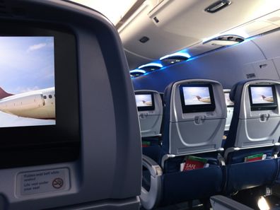 Screens on the seats of a commercial airplane