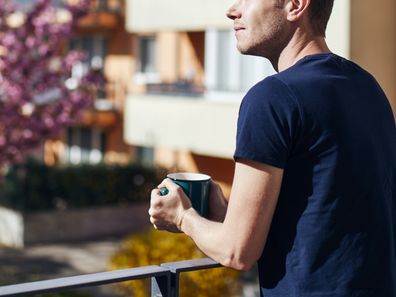 Man standing on balcony