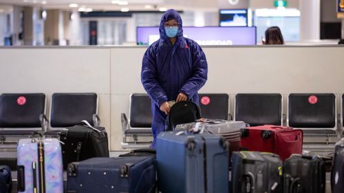 A passenger arriving at Sydney Airport this week (Edwina Pickles).