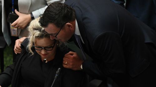 Daniel Andrews hugs Health Minister Hennessy after the assisted dying bill passed. 