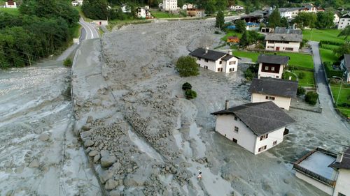 Houses covered by stones after a landslide struck during the night of in the village of Bondo, Switzerland. (AFP)