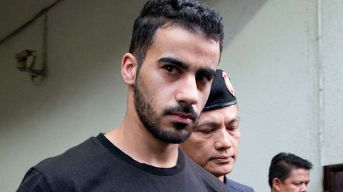 Prison guards escort Bahraini football player Hakeem al-Araibi from a court in Bangkok, Thailand.