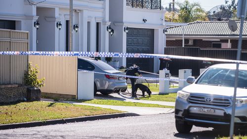 Police investigating after a man was shot outside a Greenacre home this morning in Sydney on July 26, 2023. Photo: Flavio Bracaleone / The Sydney Morning Herald