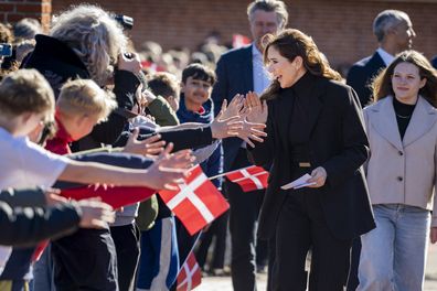 VALLENSBAEK, DENMARK - MARCH 17:  Queen Mary of Denmark is welcomed by students at Pilehaveskolen as she participates in the School Force during a visit on March 17, 2025 in Vallensbaek, Denmark. (Photo by Martin Sylvest Andersen/Getty Images)