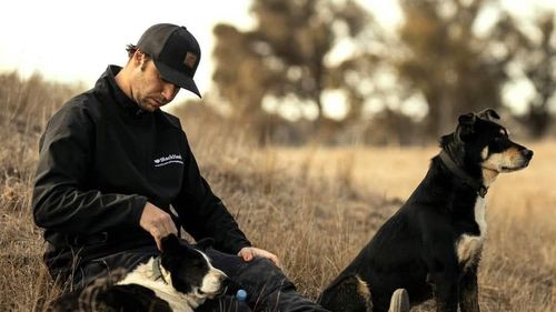 Brady Morris with two BackTrack dogs.