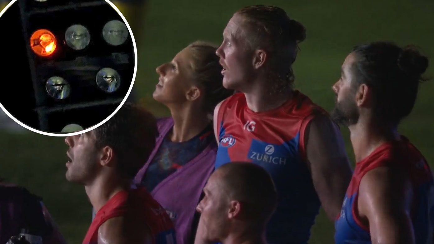 Players were left stunned as one of the globes in a light tower caught fire during the stoppage