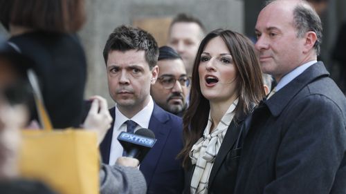 Attorney Donna Rotunno, center, waits to speak to reporters outside a Manhattan courthouse after her client, Harvey Weinstein, was found guilty. 