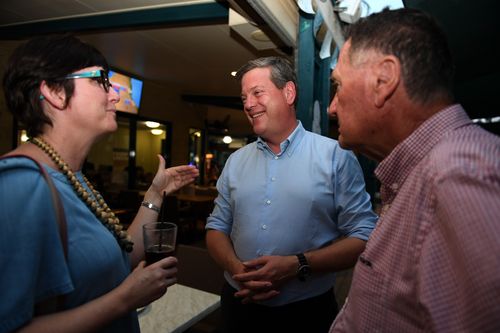 Tim Nicholls chats to pubgoers in Townsville yesterday. (AAP)