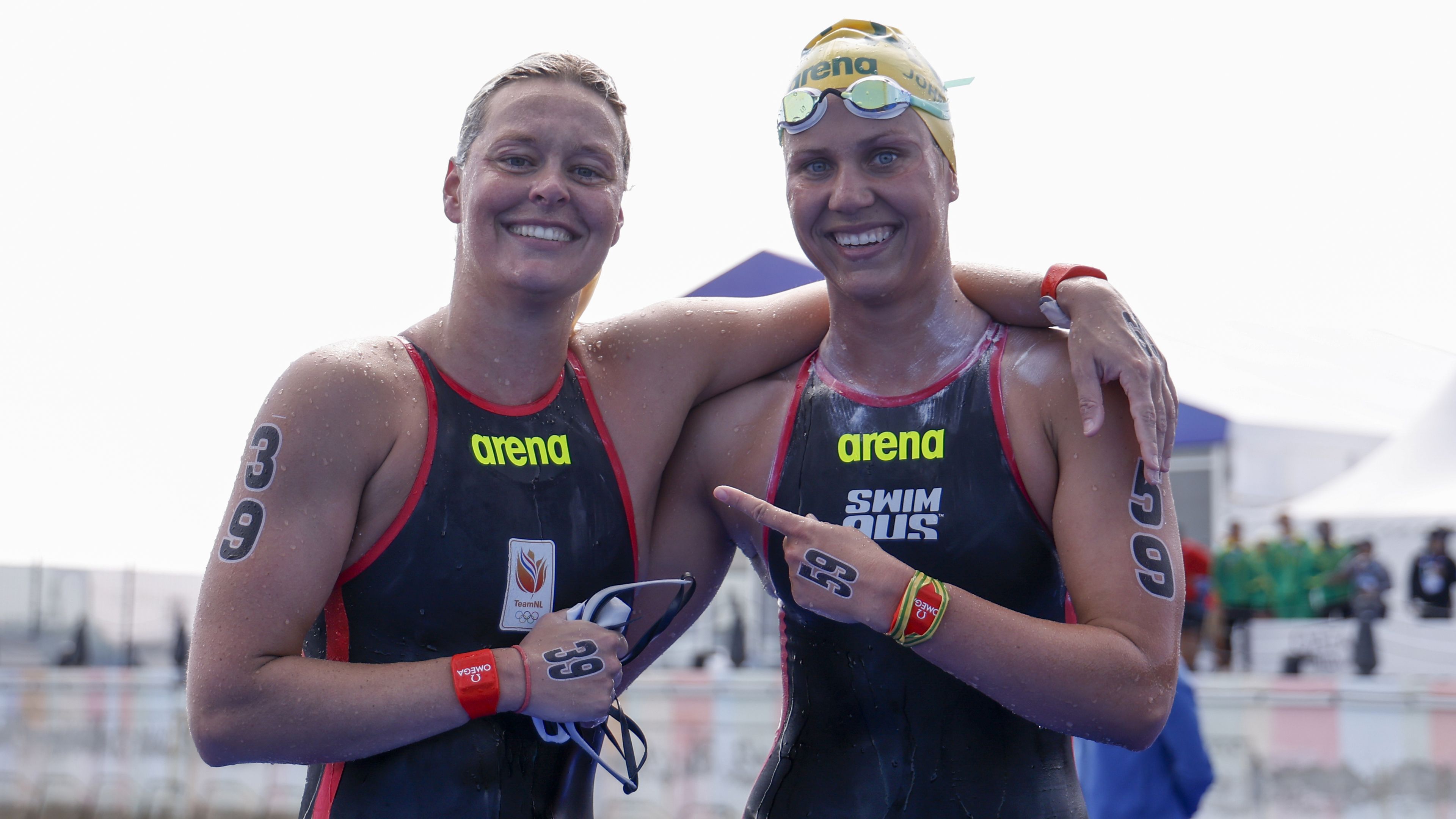 Sharon van Rouwendaal of the Netherlands and Moesha Johnson of Australia celebrate after the 10km World Aquatics Championships event.