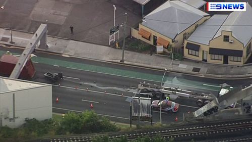 Queensland Police attend an accident involving a truck which lost its load on Annerley Road in Woolloongabba, near Brisbane CBD.