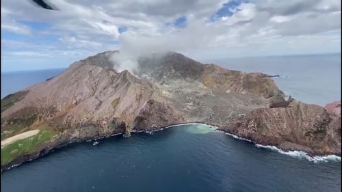 Arial video shows White Island three weeks before it erupted yesterday killing at least five people. 