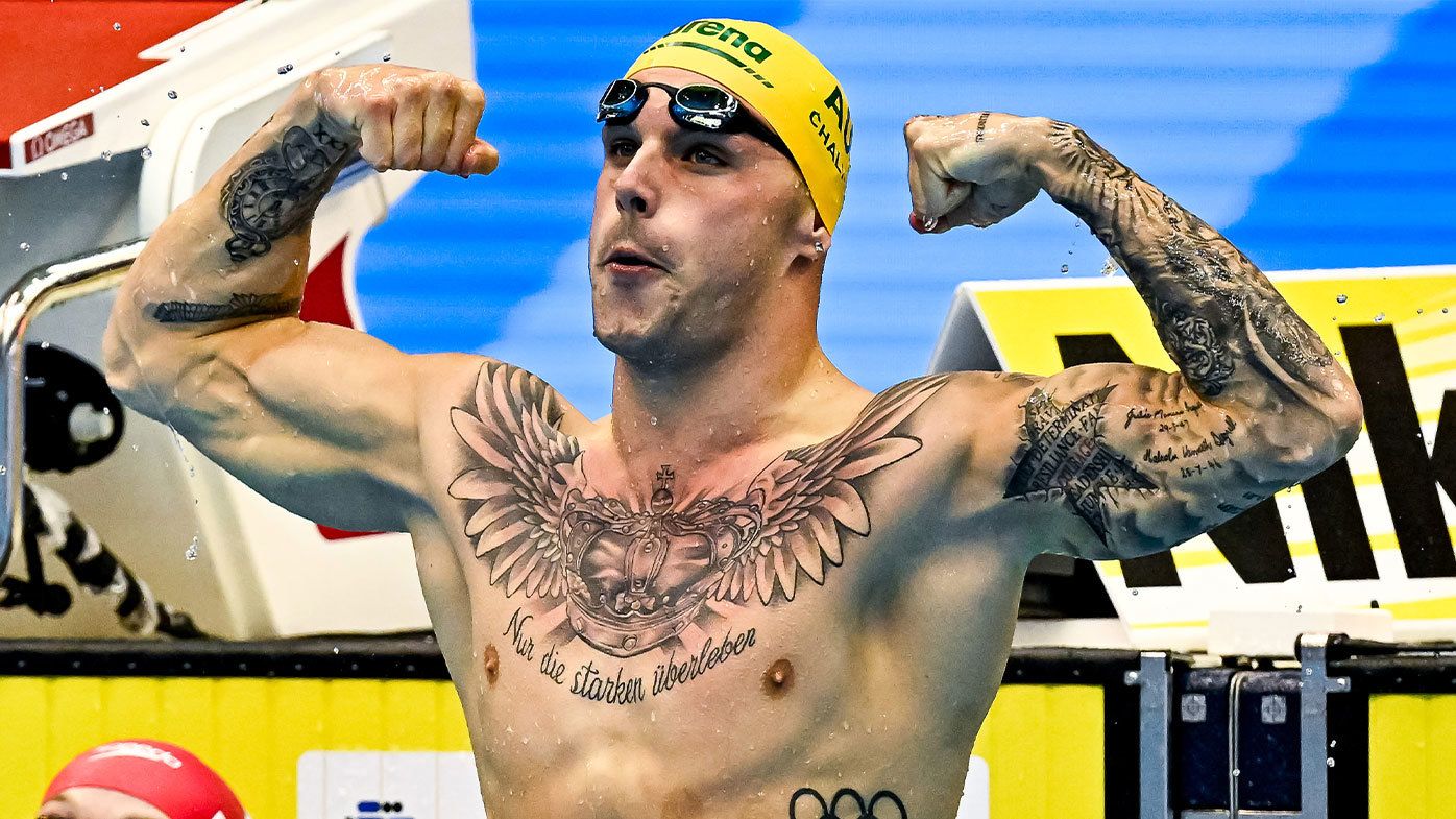 Kyle Chalmers flexes his muscles at the 2023 World Aquatics Championships in Fukuoka, Japan
