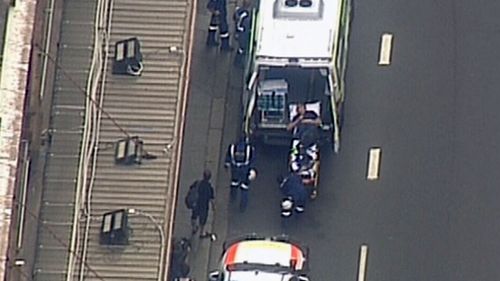 An electrician has been freed after becoming trapped in the roof of Sydney's Capitol Theatre.