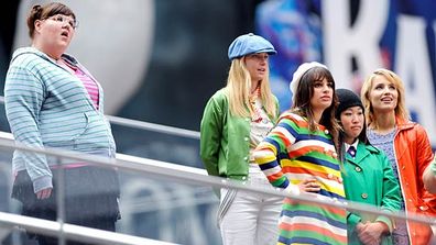 Ashley Fink, Heather Morris, Lea Michele, Jenna Ushkowitz and Dianna Agron stand atop the steps of the TKTS booth in Times Square.