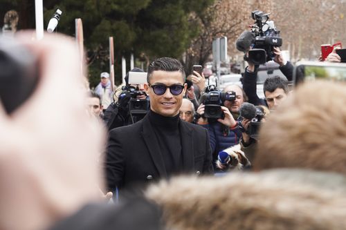 Ronaldo wore a big smile as he arrived in court in Madrid to plead guilty to tax fraud.