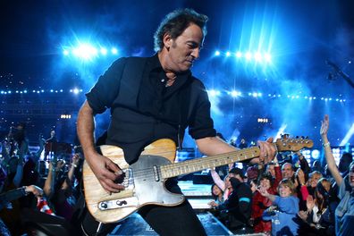 Musician Bruce Springsteen and the E Street Band perform at the Bridgestone halftime show during Super Bowl XLIII.  