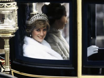 Diana, Princess of Wales, on her way to the State Opening of Parliament in November 1981.  She is travelling in the Glass Coach used for her wedding. Photo by Anwar Hussein