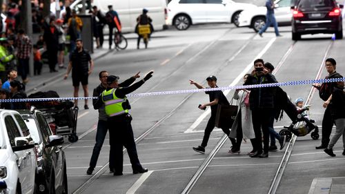 Police shut down Bourke Street.