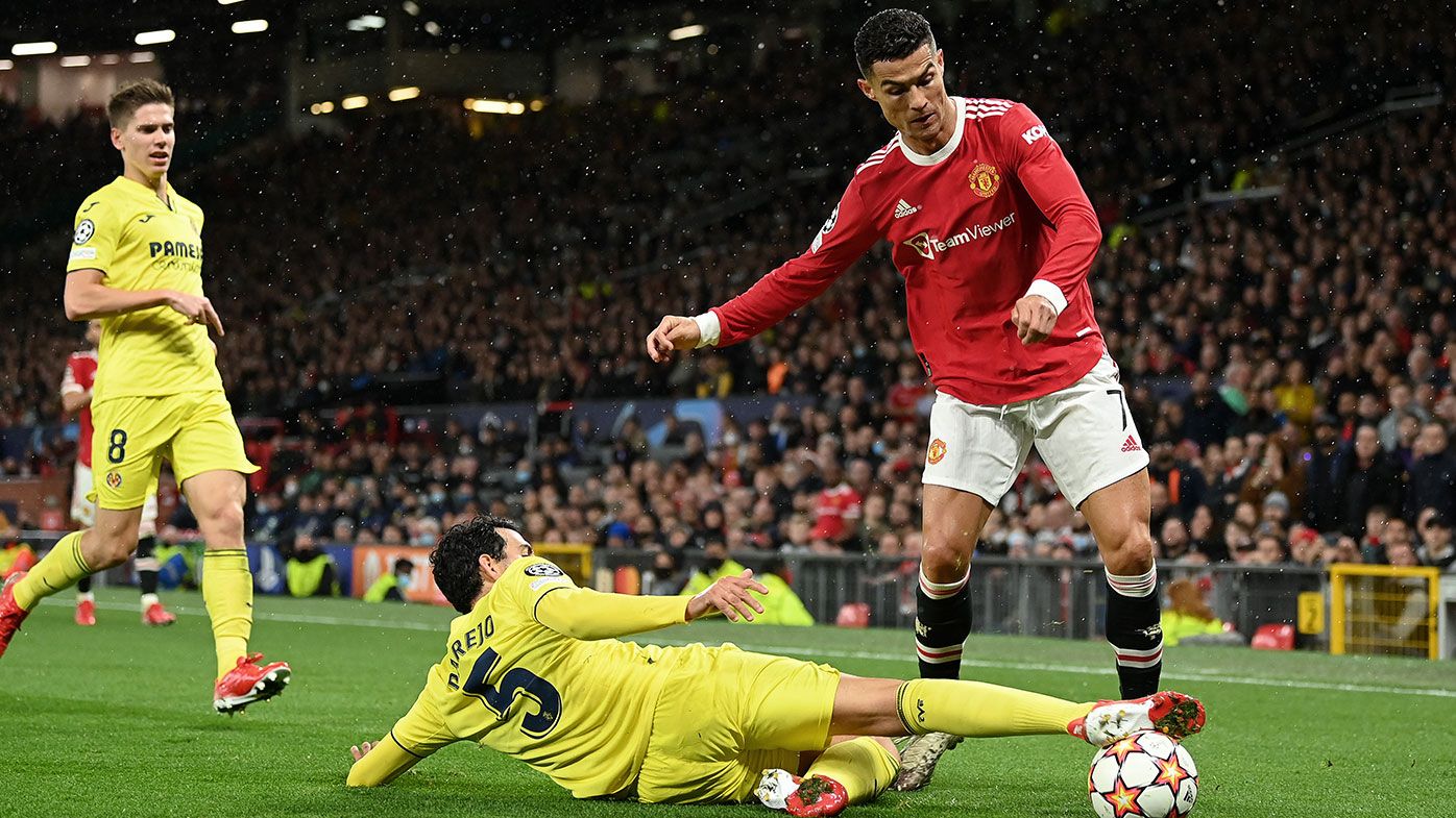  Cristiano Ronaldo of Manchester United is challenged by Daniel Parejo of Villarreal CF during the UEFA Champions League group F match between Manchester United and Villarreal CF at Old Trafford on September 29, 2021 in Manchester, England. (Photo by Michael Regan/Getty Images)