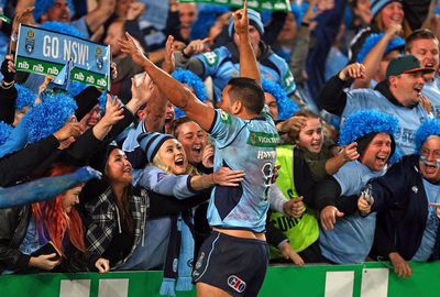 He then charged into the crowd to celebrate the NSW victory.