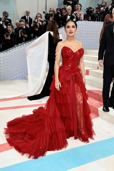 Anne Hathaway Gave the Tweed Dress a Sexy Edge on the 2023 Met Gala Red  Carpet