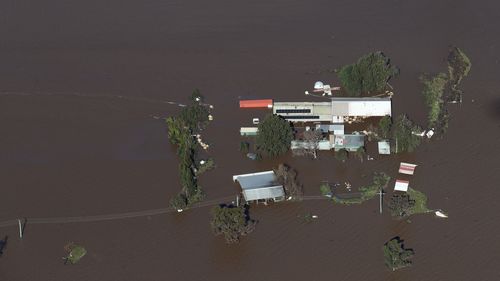 NSW Premier Dominic Perrottet surveys the floods in the Hunter Region in a chopper this morning with Minister for Emergency Services and Resilience and Minister for Flood Recovery Steph Cooke. Pictured is flooding in and around Maitland. Picture: David Swift