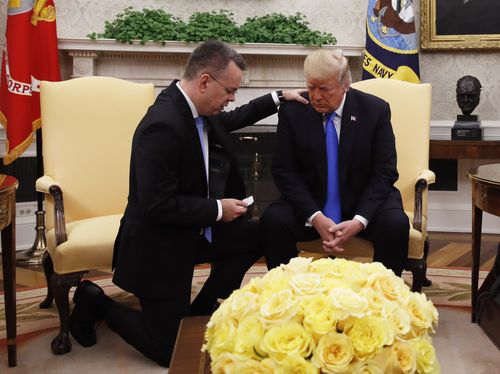 Trump prays with American pastor Andrew Brunson in the Oval Office on Saturday.