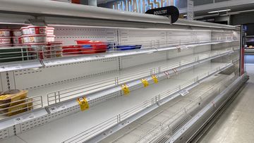 Empty supermarket shelves at Coles