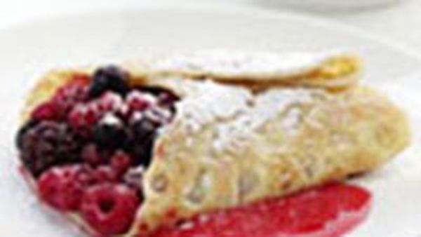 Berry-filled crepes with raspberry coulis