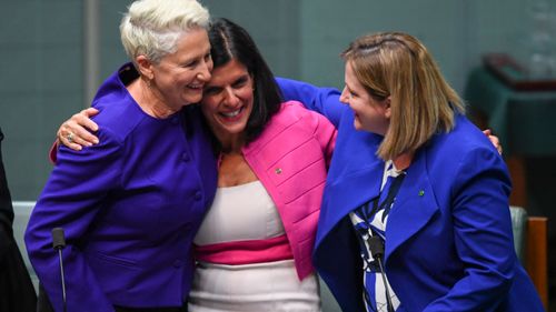 Kerryn Phelps, Julia Banks and Rebekha Sharkie react after the passing of the Medivac Bill.