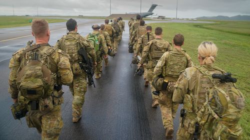 Australian Defense Force contingent at the RAAF base in Townsville, Queensland, before departing for the Solomon Islands