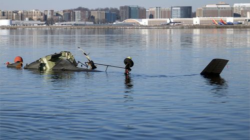 In this image provided by the U.S. Coast Guard, wreckage is seen in the Potomac River near Ronald Reagan Washington National Airport, Thursday, Jan. 30, 2025, in Washington. (Petty Officer 1st Class Brandon Giles/U.S. Coast Guard via AP)